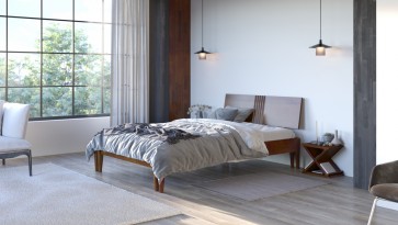  Drewniane łóżko sypialniane na tle jasnej ściany oraz podłogi