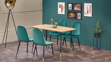Elegancka jadalnia z stołem w zestawieniu z tapicerowanymi krzesłami na metalowych nogach