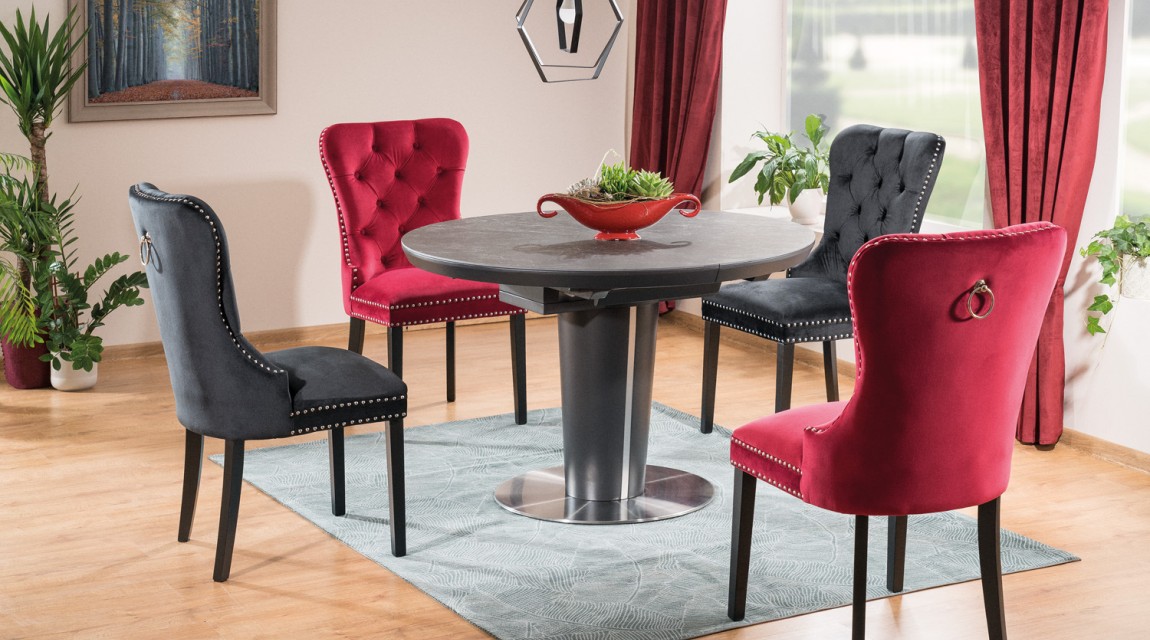 Nowoczesna jadalnia w stylu glamour z okrągłym stołem rozkładanym i pikowanymi krzesłami aksamitnymi