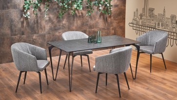 Nierozkładany stół do jadalni w zestawieniu z tapicerowanymi krzesłami