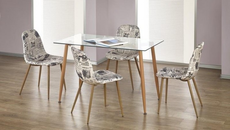 Nierozkładany stół ze szklanym blatem i tapicerowane krzesła z motywem na siedzisku i oparciu