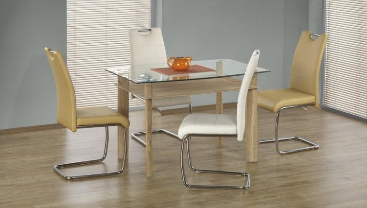 Krzesła na płozach tapicerowane ekoskórą z rączką ułatwiającą ich odsuwanie od stołu