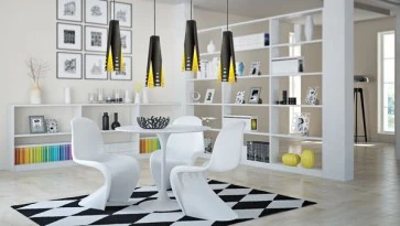 Designerskie lampy wiszące oraz okrągły stół z profilowanymi krzesłami