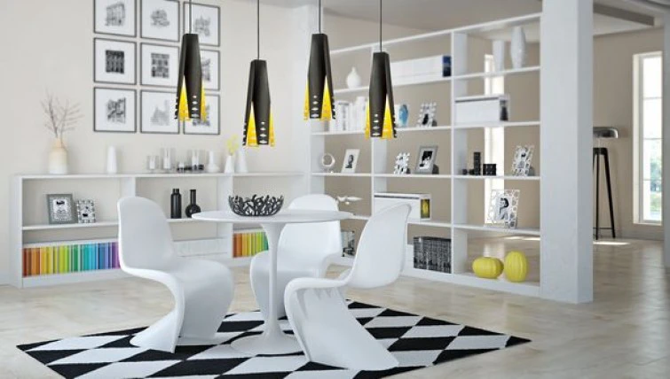 Designerskie lampy wiszące oraz okrągły stół z profilowanymi krzesłami