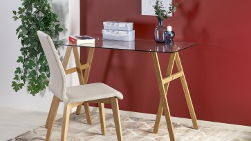 Designerskie biurko na stalowych nogach ze szklanym blatem