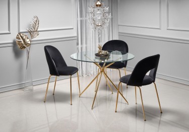 Elegancka jadalnia z tapicerowanymi krzesłami i okrągłym stołem w stylu glamour