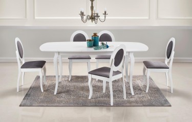 Jadalnia w stylu retro z białym stołem i drewnianymi krzesłami