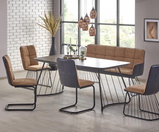Nierozkładany stół z bazaltowym blatem i tapicerowane krzesła na metalowych płozach