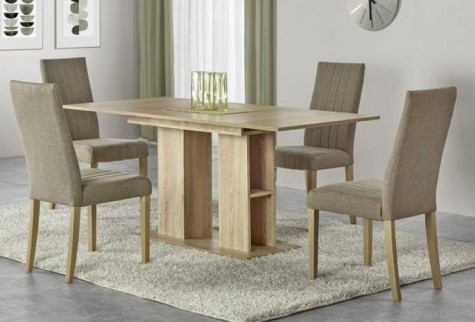 Wnętrze jadalniane uzupełnione w rozkładany stół i tapicerowane krzesła na kremowym dywanie