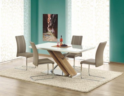 Lakierowany stół z nakładką szklaną na blacie i krzesła na płozach pokryte skórą ekologiczną