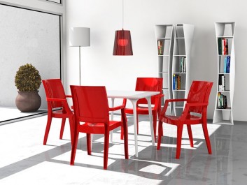 Czerwone designerskie krzesła z tworzywa sztucznego z podłokietnikami uzupełnieniem białego stołu na czterech nogach