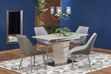 Nowoczesny stół na jednej nodze oraz tapicerowane krzesła na metalowych nogach