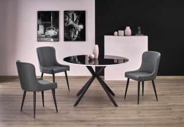 Stół z okrągłym blatem ze szkła na stylowej podstawie oraz tapicerowane krzesła