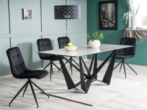 Designerski stół nierozkładany z krzesłami tapicerowanymi tkaniną aksamitną w jadalni o zielonych ścianach